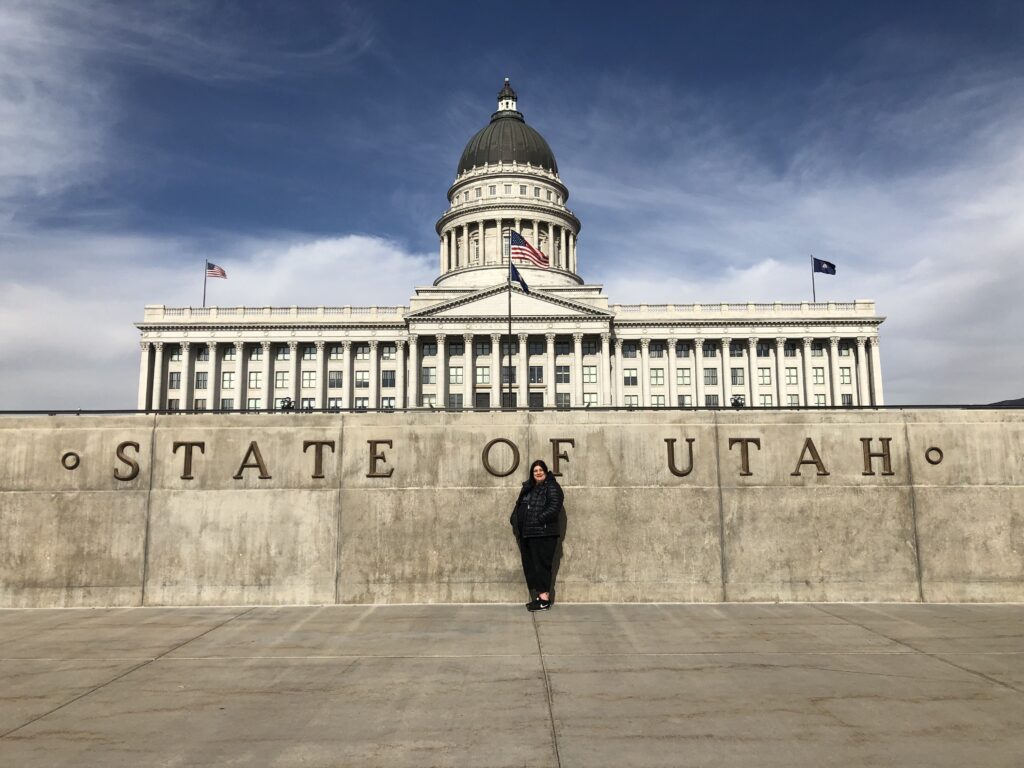Womsn infront of Utah State Capitol Building