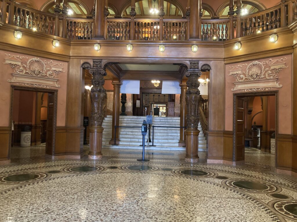 A decorated stone floor and wooden carved walls and designs