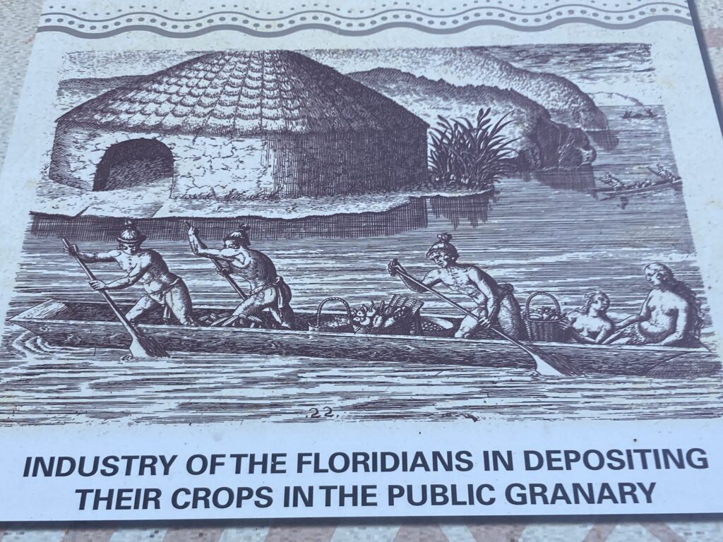 An image of people depositing goods in public granary