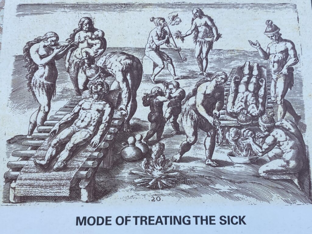 An image of people treating a sick comrade