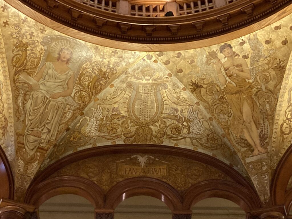Vintage golden painted dome with two women and white birds
