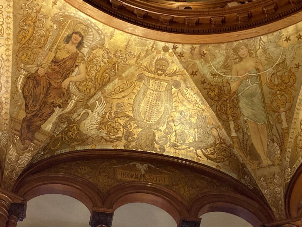 Vintage golden painted dome with two women and white birds