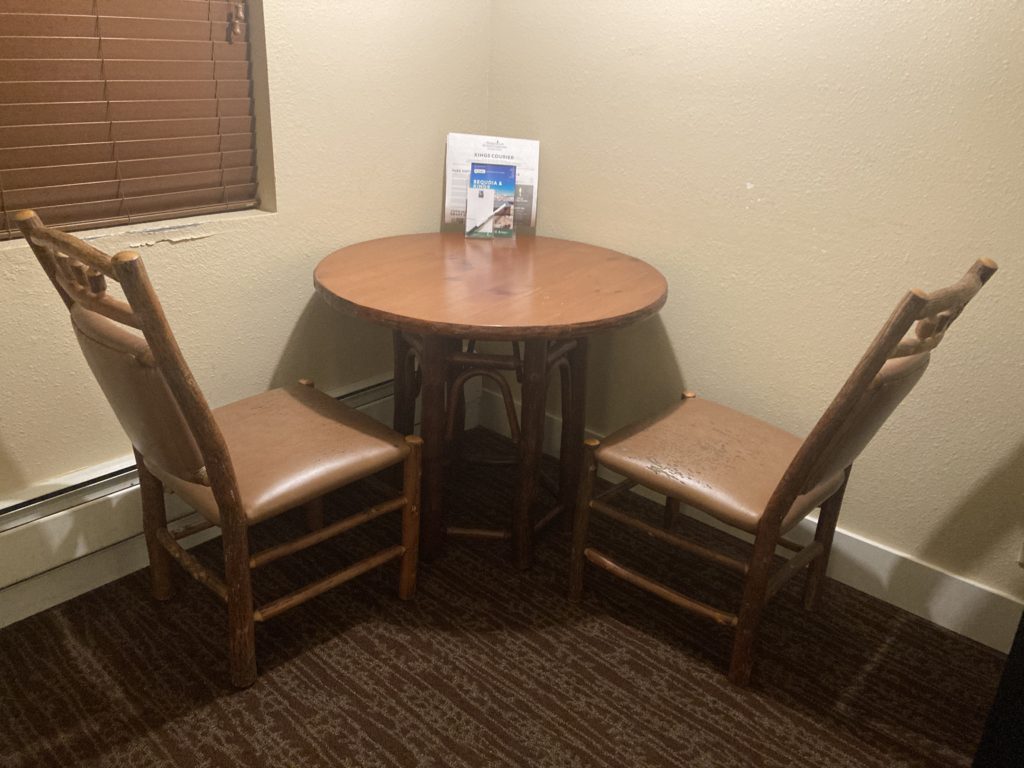 Brown Table and Chairs in the corner
