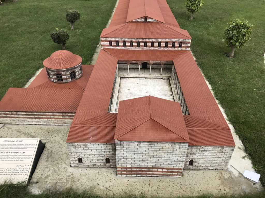 Orange Roof Brick Building Miniature in the Ground