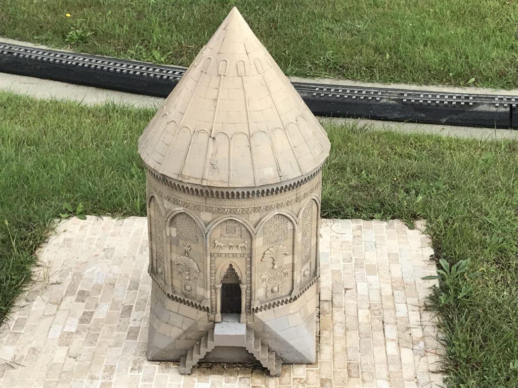 Ivory Colored Building Tower Miniature in the Grass