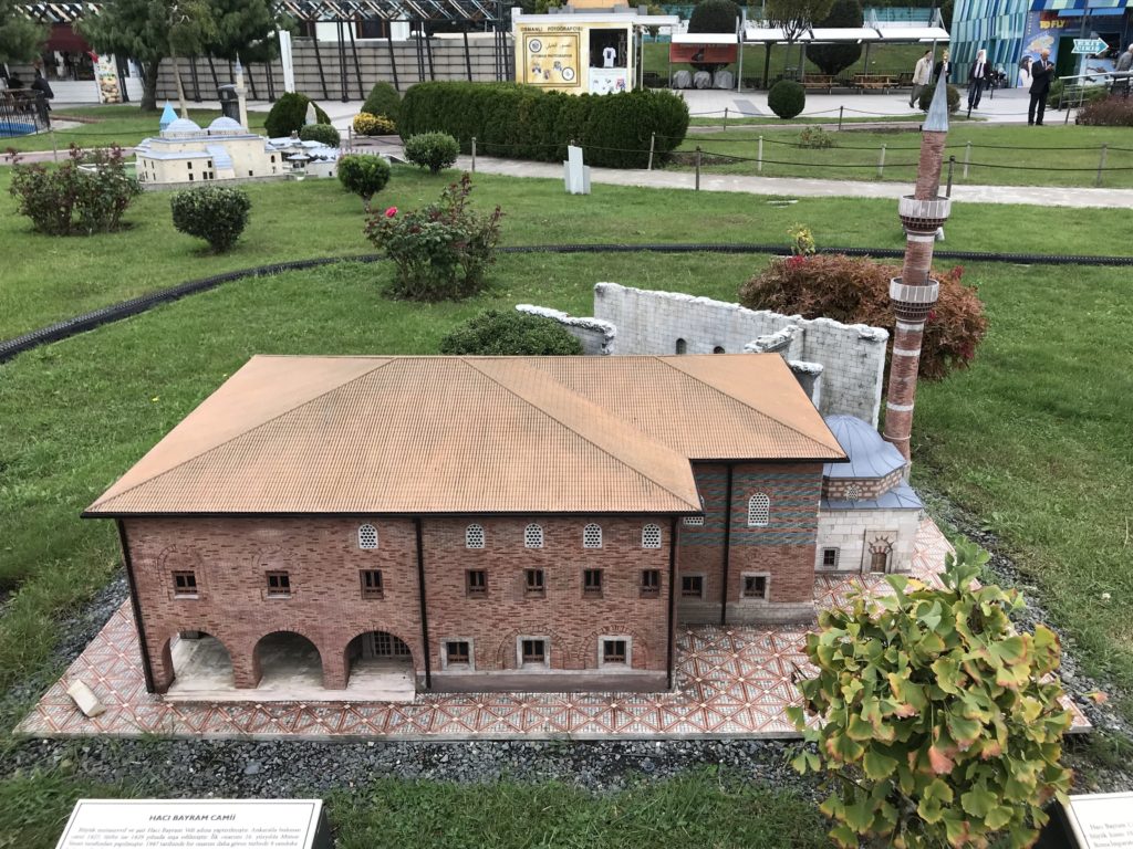 Brown Building with Tower Miniature in the Ground