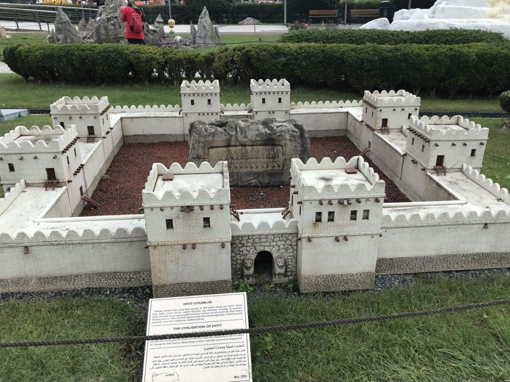 White Building Miniature in the Ground