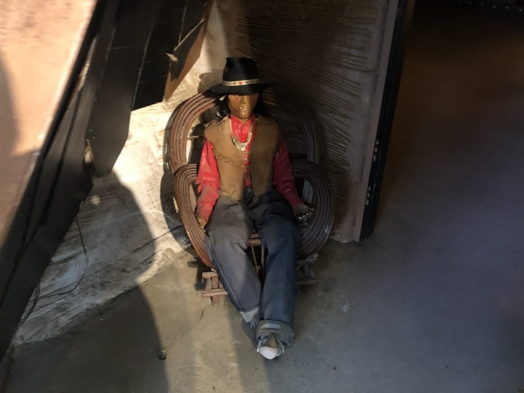 A statue sitting on a chair