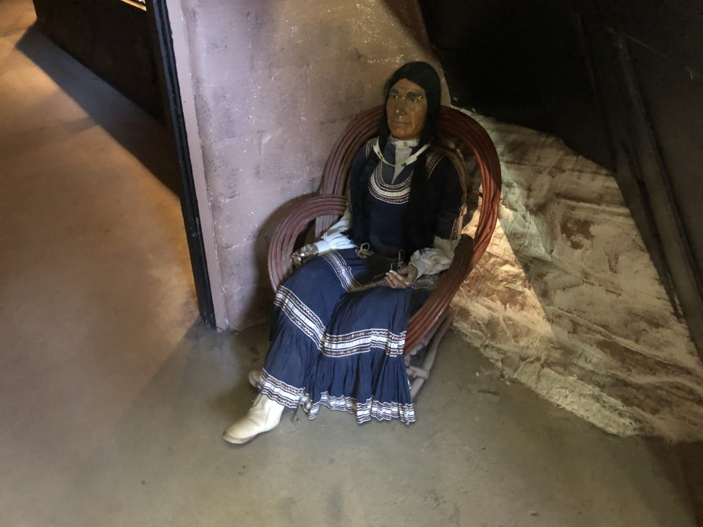 A statue sitting on a chair