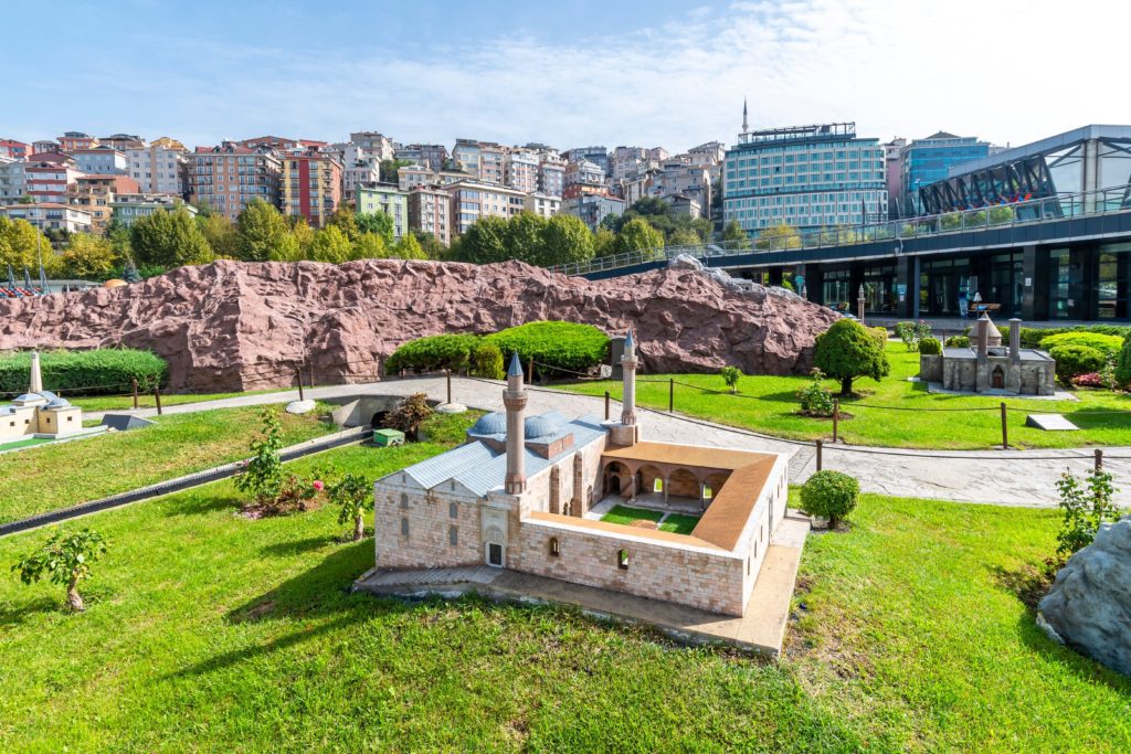 Isa Bey Mosque in Seljuk Miniatuare in the Ground with Buildings in the Background